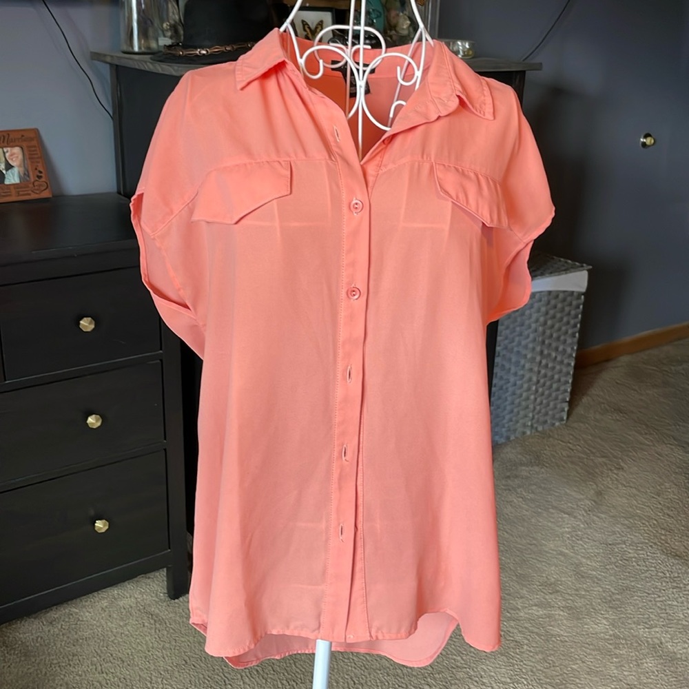 Peachy pink sleeveless blouse